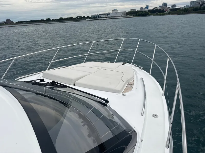 Slide: The Image of The image shows the foredeck of a 2023 Princess F45 yacht with sunbathing areas. - 16