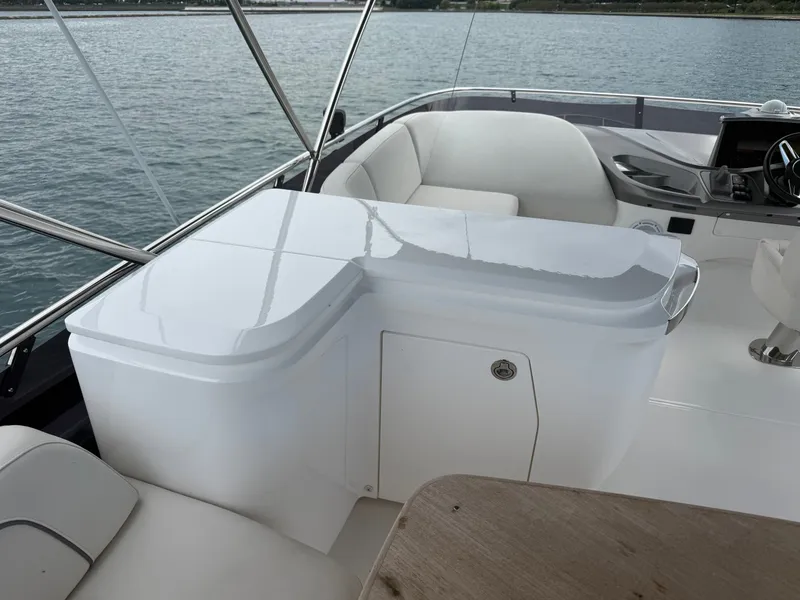 Slide: The Image of The image shows the cockpit of a 2023 Princess F45 with sleek white seating. - 34