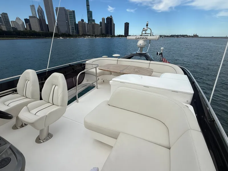 Slide: The Image of The image shows the deck of a 2023 Princess F45 yacht with a city skyline view. - 32