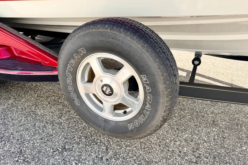 Slide: The Image of Trailer tire of a 2009 Ranger 620VS Fisherman boat on pavement. - 81