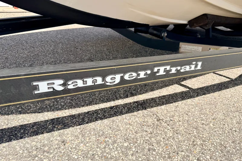 Slide: The Image of Trailer for 2009 Ranger 620VS Fisherman boat on asphalt surface. - 78