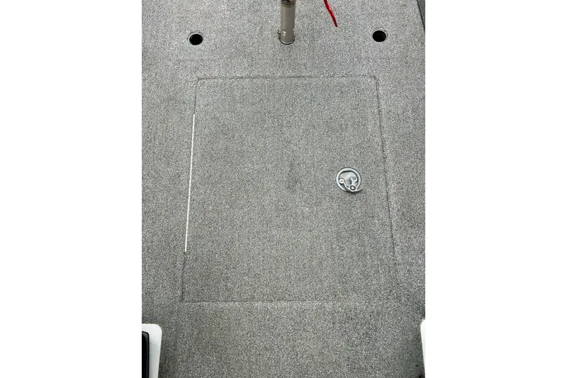 Slide: The Image of 2009 Ranger 620VS Fisherman boat deck with storage hatch and carpeted surface. - 62