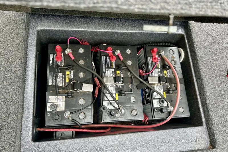 Slide: The Image of Three Duracell marine batteries in a 2009 Ranger 620VS Fisherman boat compartment. - 63