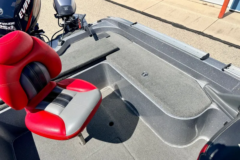 Slide: The Image of 2009 Ranger 620VS Fisherman boat interior with red and gray seat, Evinrude motor visible. - 76