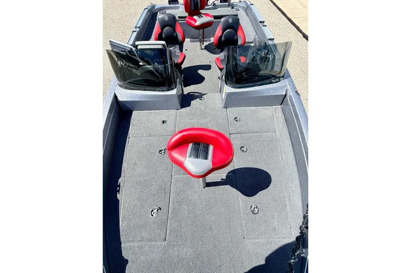 Slide: The Image of 2009 Ranger 620VS Fisherman boat interior with red and black seating, spacious deck. - 70