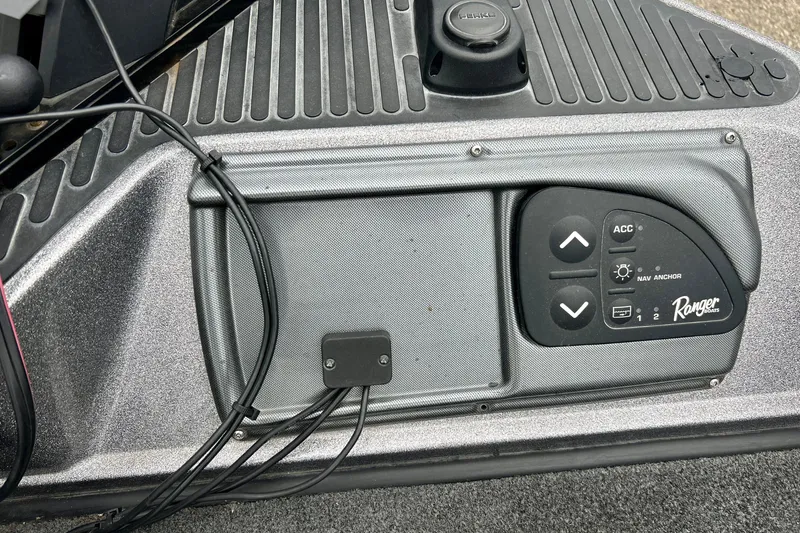 Slide: The Image of Control panel of a 2009 Ranger 620VS Fisherman boat with navigation and accessory buttons. - 59