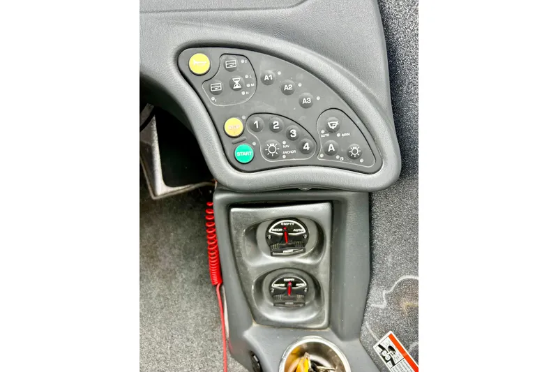 Slide: The Image of Control panel of a 2009 Ranger 620VS Fisherman boat with various buttons and gauges. - 31