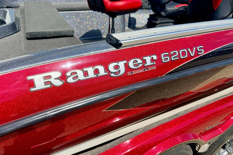 Slide: The Image of Red 2009 Ranger 620VS Fisherman boat with visible logo and sleek design. - 8