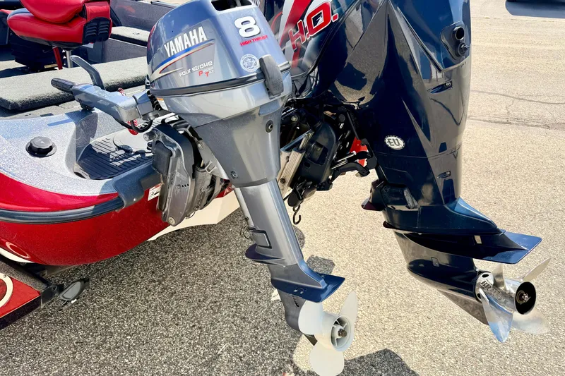 Slide: The Image of 2009 Ranger 620VS Fisherman boat with Yamaha 8HP outboard motor, red and gray design. - 13