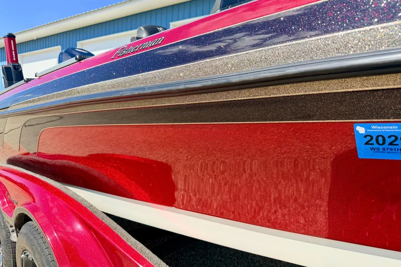 Slide: The Image of 2009 Ranger 620VS Fisherman boat with red and metallic finish, Wisconsin registration sticker. - 6