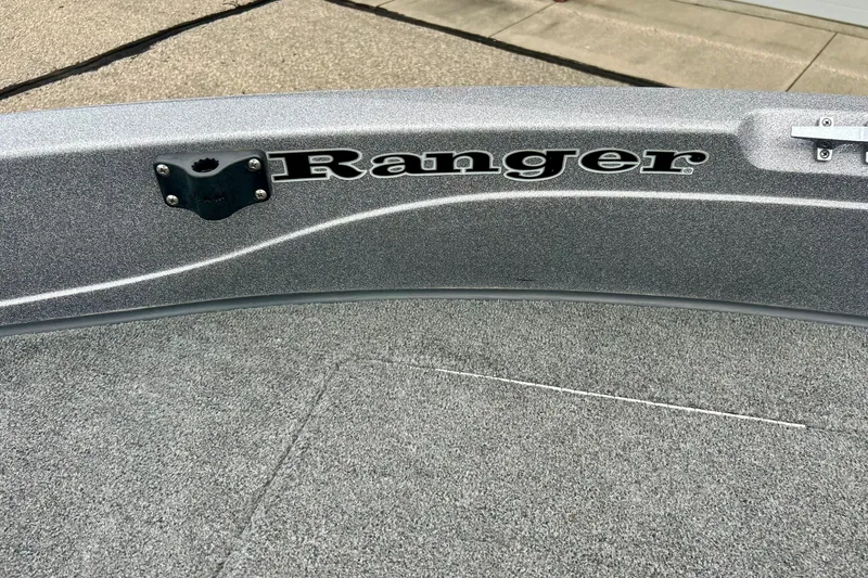 Slide: The Image of 2009 Ranger 620VS Fisherman boat interior with logo and textured flooring. - 60