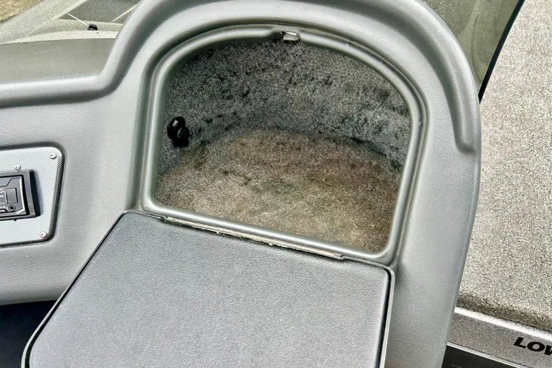 Slide: The Image of 2009 Ranger 620VS Fisherman boat storage compartment with carpeted interior. - 34