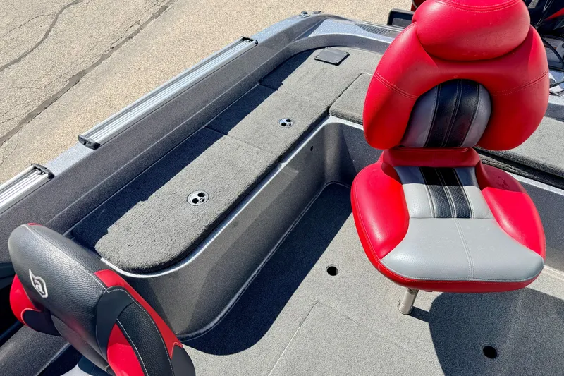 Slide: The Image of 2009 Ranger 620VS Fisherman boat interior with red and gray seating. - 75