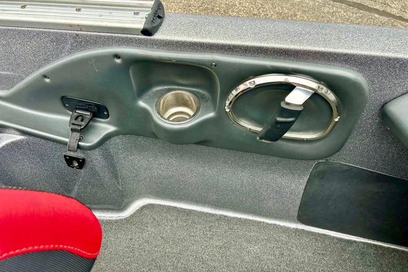 Slide: The Image of Interior of a 2009 Ranger 620VS Fisherman boat, featuring cup holder and handle. - 35