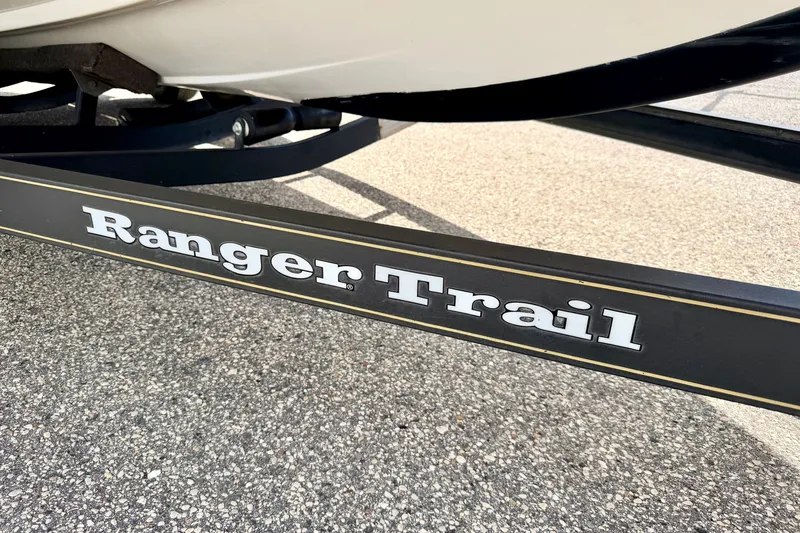 Slide: The Image of Trailer of 2009 Ranger 620VS Fisherman boat on pavement. - 82