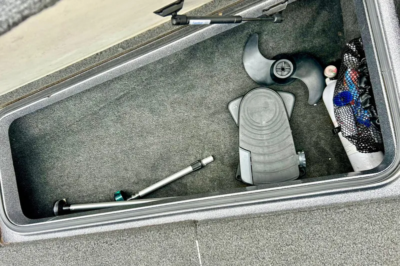 Slide: The Image of Storage compartment of a 2009 Ranger 620VS Fisherman boat with accessories and equipment. - 53
