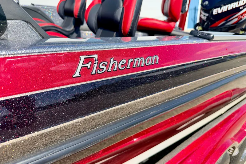 Slide: The Image of 2009 Ranger 620VS Fisherman boat with red and black detailing, featuring Evinrude engine. - 16