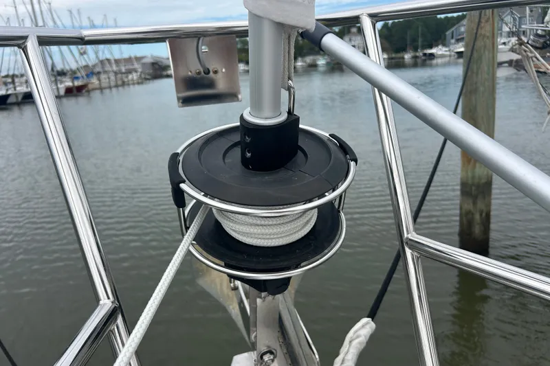 Slide: The Image of Close-up of a 2009 Beneteau 343 sailboat's furling system at a marina. - 33