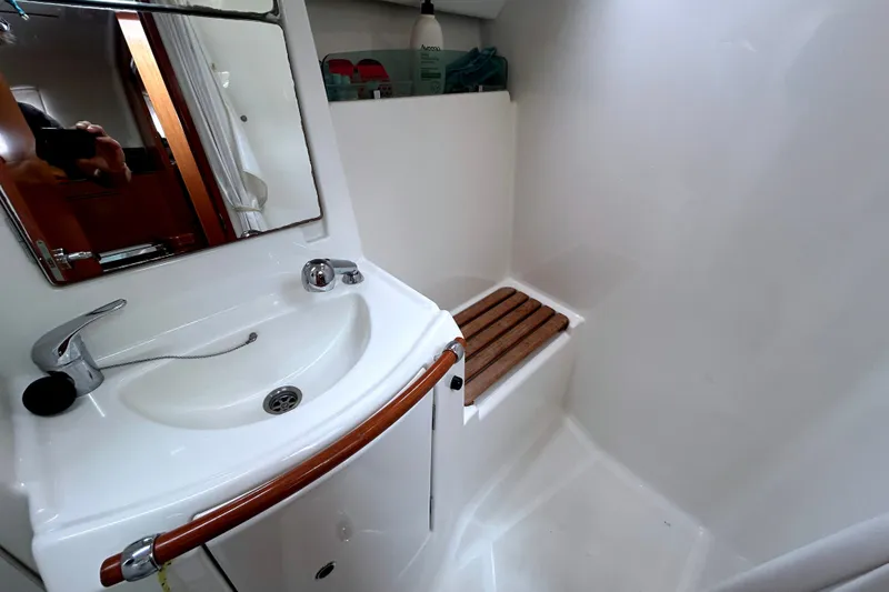 Slide: The Image of Bathroom interior of 2009 Beneteau 343 yacht with sink and wooden seat. - 32