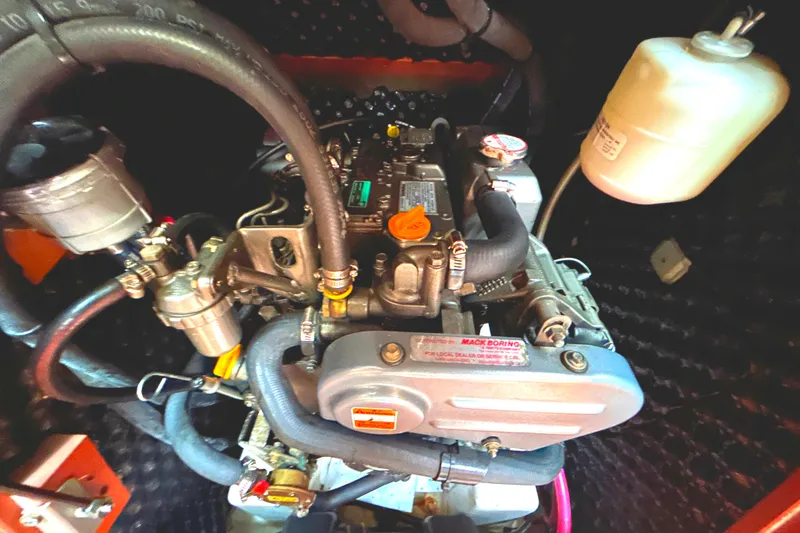 Slide: The Image of Engine compartment of a 2009 Beneteau 343 sailboat, showcasing mechanical components. - 37