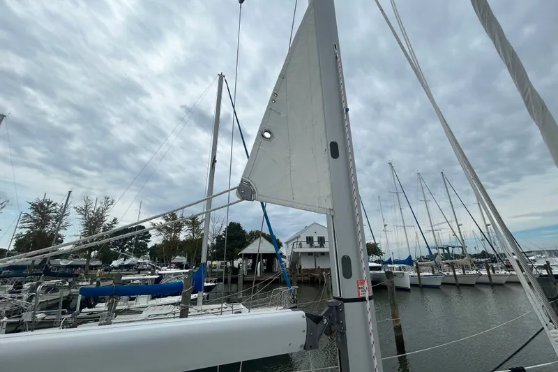 Slide: The Image of Sailboat Beneteau 343, 2009 model, docked at marina with cloudy sky. - 35