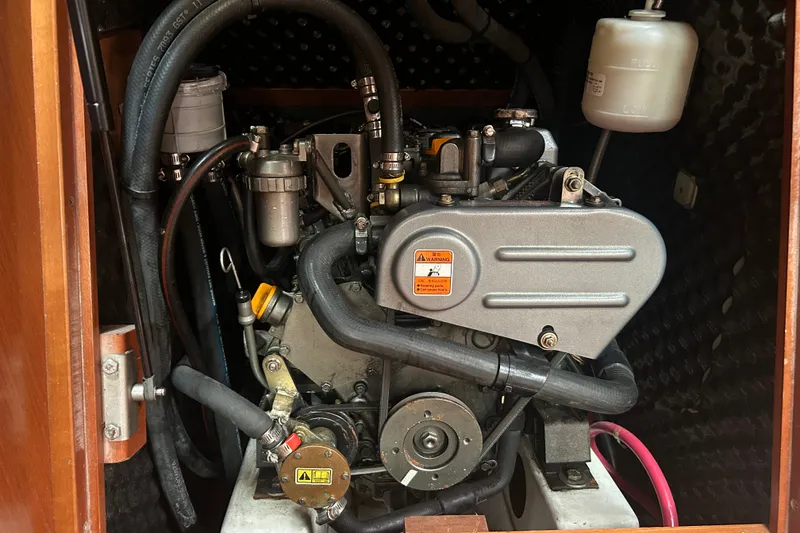 Slide: The Image of Engine compartment of a 2009 Beneteau 343 sailboat, showcasing mechanical components. - 38