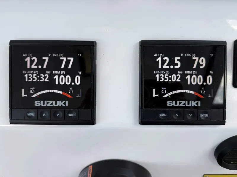 Slide: The Image of Two Suzuki engine displays show various engine data such as RPM and trim angle. - 21