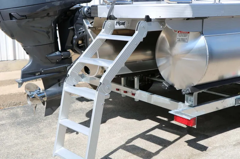 Slide: The Image of A silver boat ladder leads to a motorboat with an outboard engine. - 21