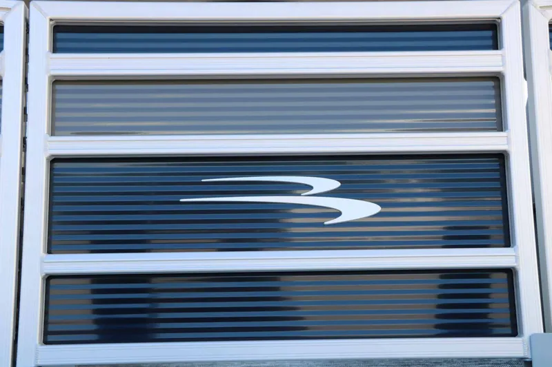 Slide: The Image of Close-up of a boat logo on a striped background. - 9