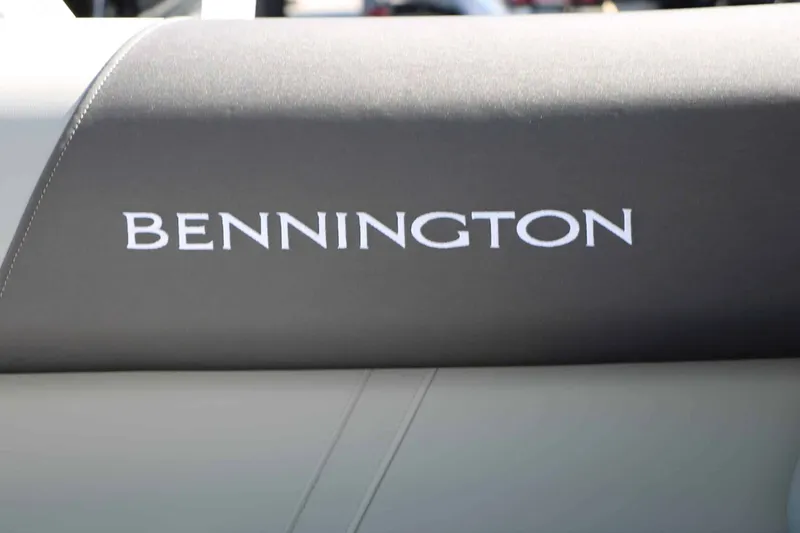 Slide: The Image of Close-up of the Bennington logo on a gray upholstered seat. - 31