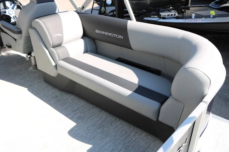 Slide: The Image of Gray and black bench seat on a Bennington boat, featuring modern design and comfortable upholstery. - 49