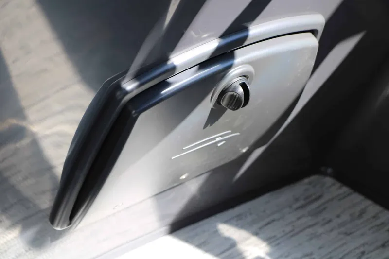 Slide: The Image of Close-up of a boat switch with a knob on a sleek surface. - 43