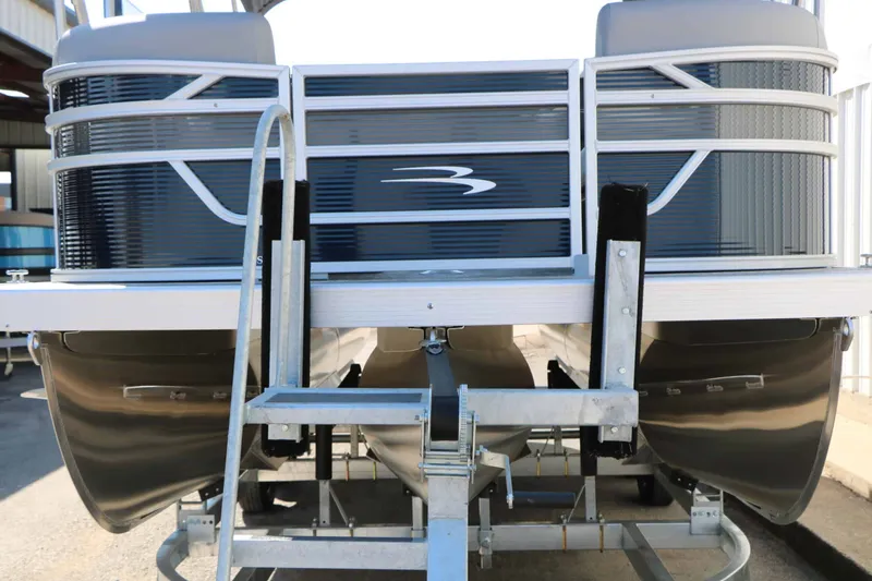 Slide: The Image of Bennington 22 SSR Tri Toon 2027 on a trailer, featuring a sleek design and sturdy structure. - 7