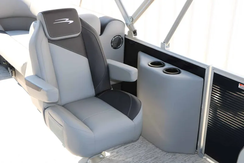 Slide: The Image of A luxurious gray captain's chair with armrests and cup holders on a modern boat. - 33