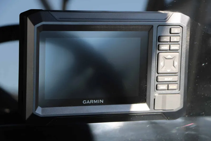 Slide: The Image of Garmin navigation system on a boat, featuring buttons and a screen. - 40