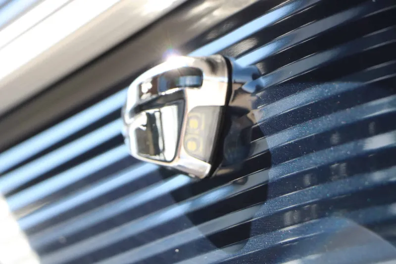 Slide: The Image of Close-up of a shiny blue boat hull with a silver fitting. - 26