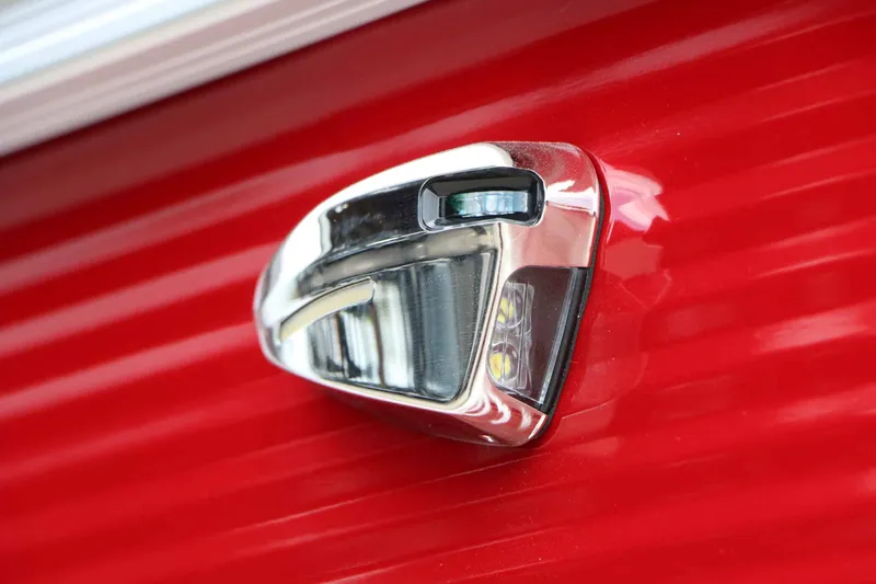 Slide: The Image of Close-up of a shiny metal handle on a red background. - 11