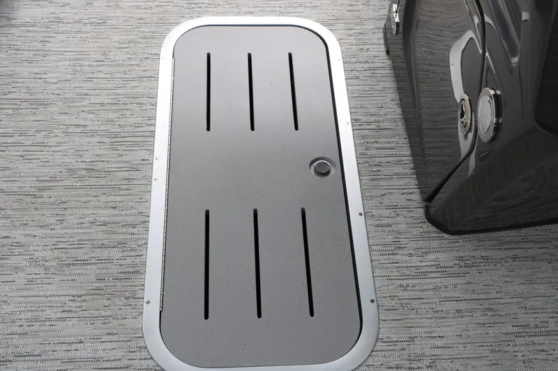 Slide: The Image of A gray flooring with a rectangular hatch featuring slots and a handle. - 39
