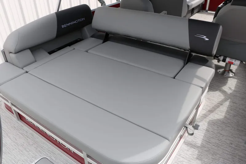 Slide: The Image of The Bennington 22 SSB Tri Toon features gray cushions providing a comfortable seating area on the boat. - 42