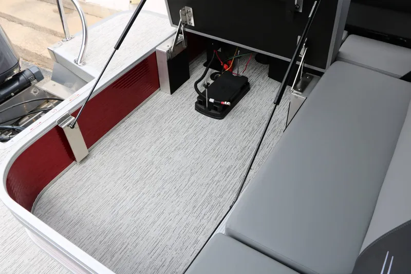 Slide: The Image of The image shows the interior of a 2027 Bennington 22 SSB Tri Toon with gray seating. - 47