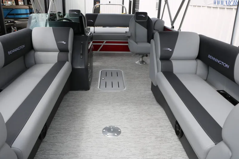 Slide: The Image of The image shows the interior of a 2027 Bennington 22 SSB Tri Toon with gray and black seating. - 26