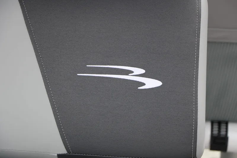Slide: The Image of Close-up of a gray seat with the Bennington logo, part of a 2027 model. - 43