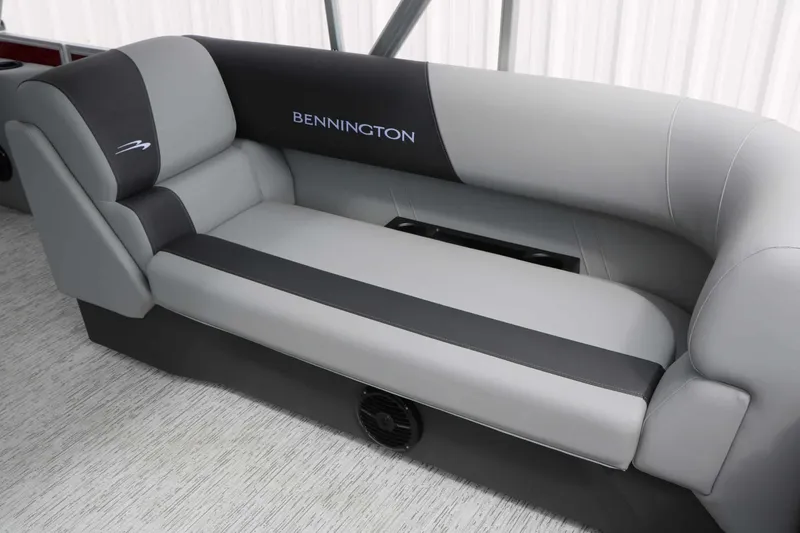 Slide: The Image of The image shows a gray and black bench seat in a Bennington 22 SSB Tri Toon boat. - 27