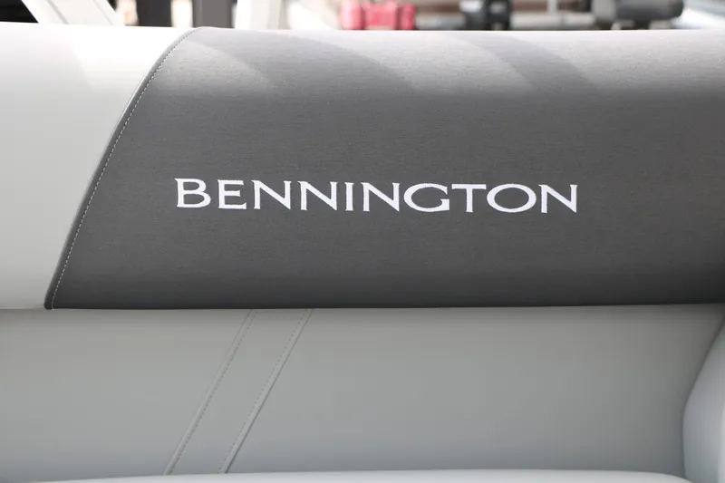 Slide: The Image of Close-up of a gray and white seat with the Bennington logo. - 29