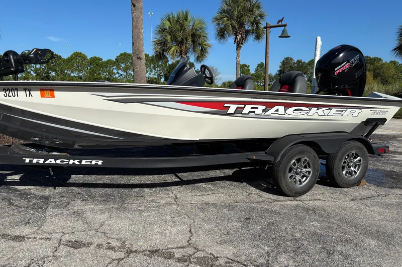 The Image of 2025 Tracker Pro Team 195 Tournament Edition boat on trailer, parked outdoors. - 0