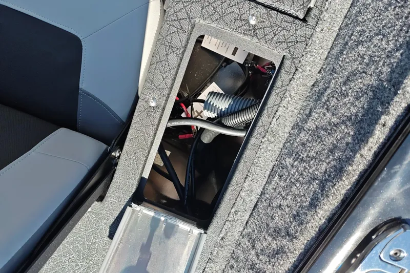 Slide: The Image of 2027 Tracker Pro Guide V-175 Combo boat interior storage compartment with wiring. - 37