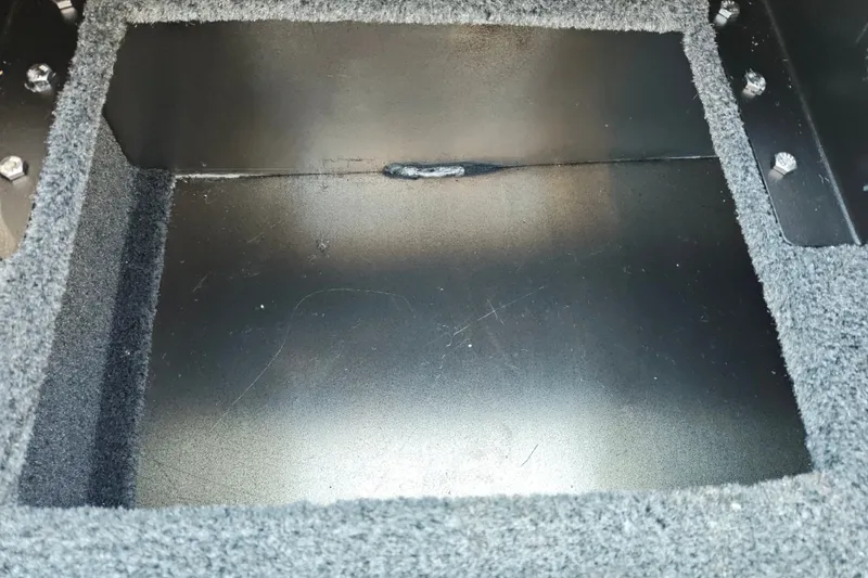 Slide: The Image of Carpeted storage compartment in 2027 Tracker Pro Guide V-175 Combo boat. - 43