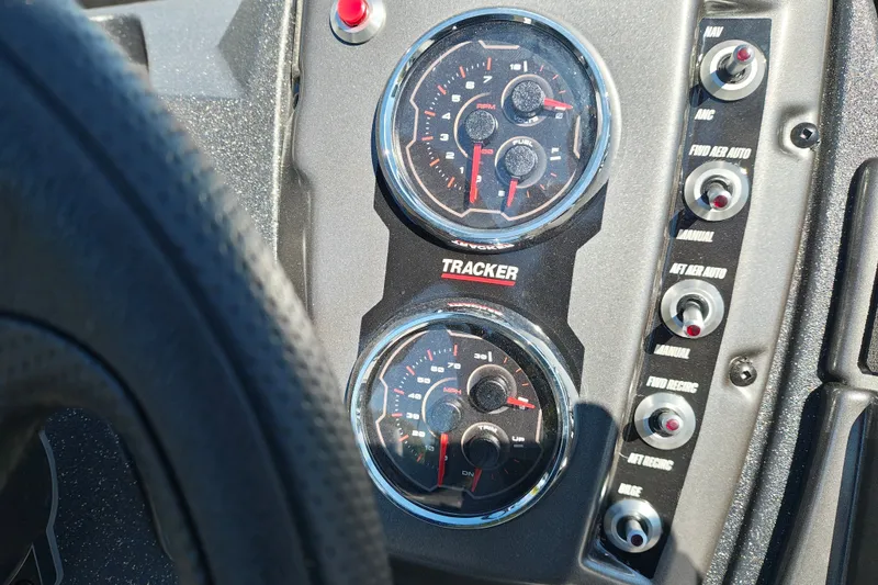 Slide: The Image of Dashboard of 2027 Tracker Pro Guide V-175 Combo with gauges and control switches. - 14