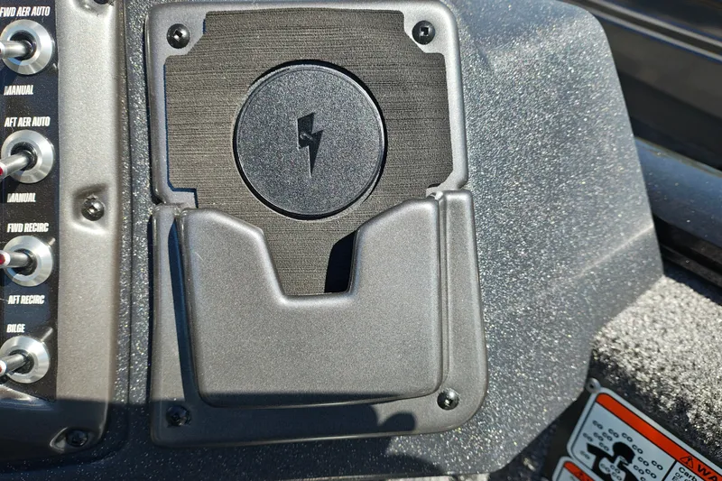 Slide: The Image of Control panel of 2027 Tracker Pro Guide V-175 Combo boat with switches and charging dock. - 18