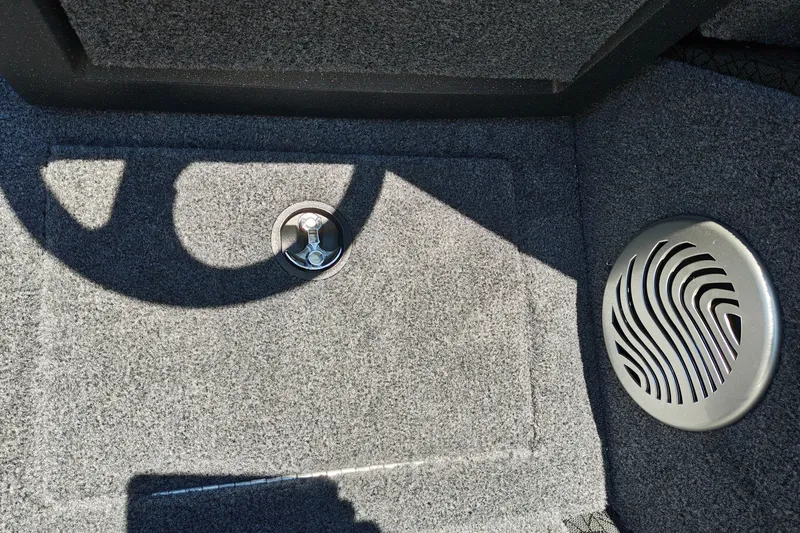 Slide: The Image of Carpeted interior of 2027 Tracker Pro Guide V-175 Combo boat with speaker and latch. - 16